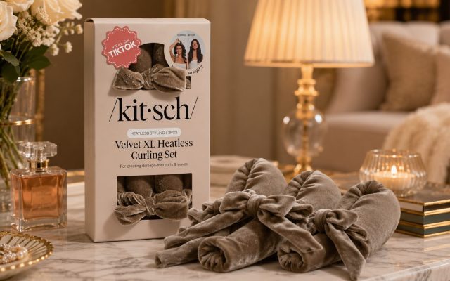 Kitsch Velvet XL Heatless Curling Set box with velvet curling rod and bow scrunchies on a marble table in warm lamplight